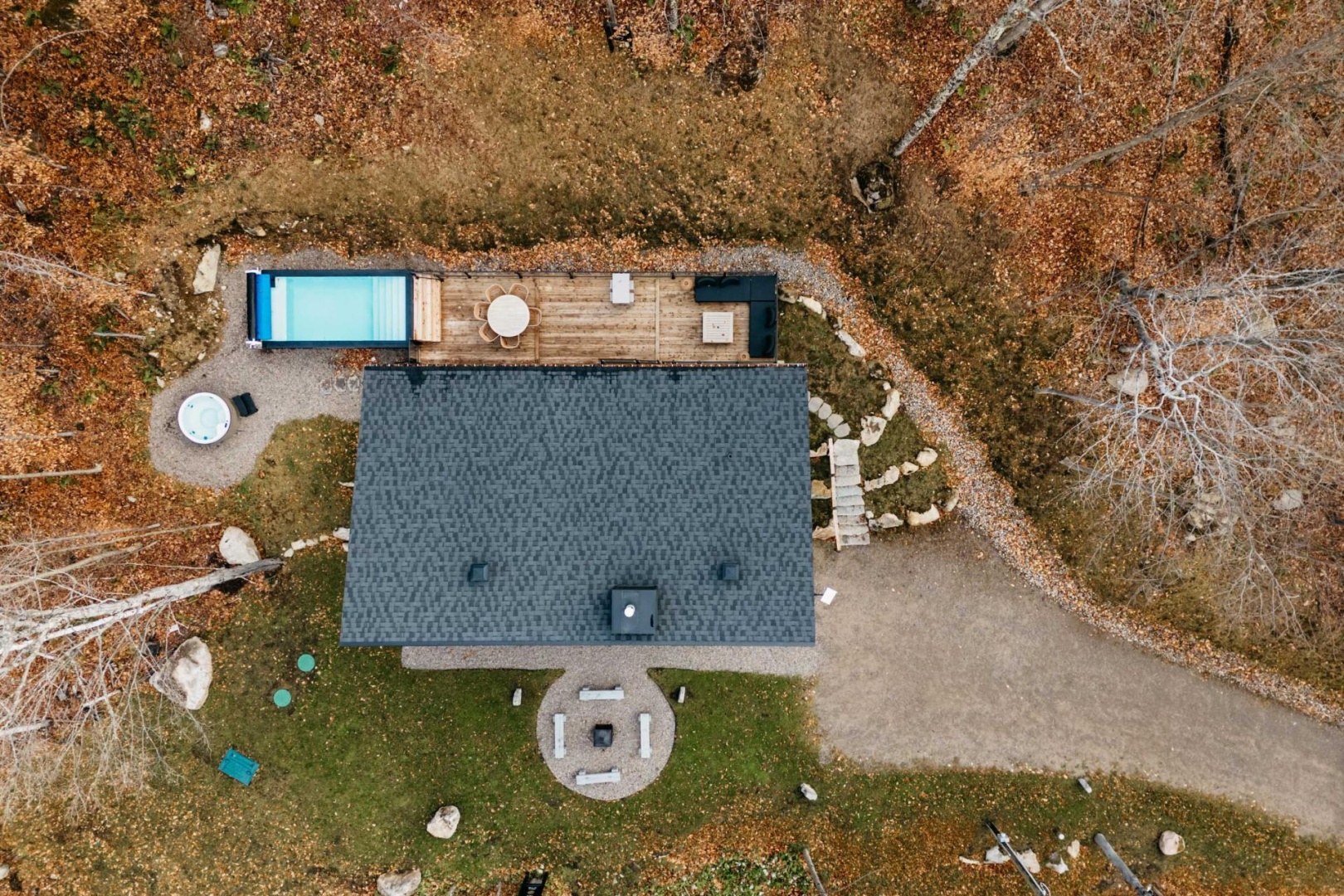 Property 01 — cedar deck over the lake at blue hour
